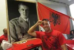 albania car enver_hoxha flag hoxhaism hoxhamobile meta:photo portrait raised_fist red_flag salute vehicle // 626x426 // 61KB