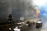 armchair black_hair catgirl character:alunya fire mask protest riot site:leftypol sofa street // 991x656 // 757KB