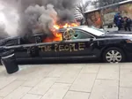 anarchism anti_fascism car circle_a donald_trump fire limousine meta:photo protest united_states vehicle // 575x431 // 43KB